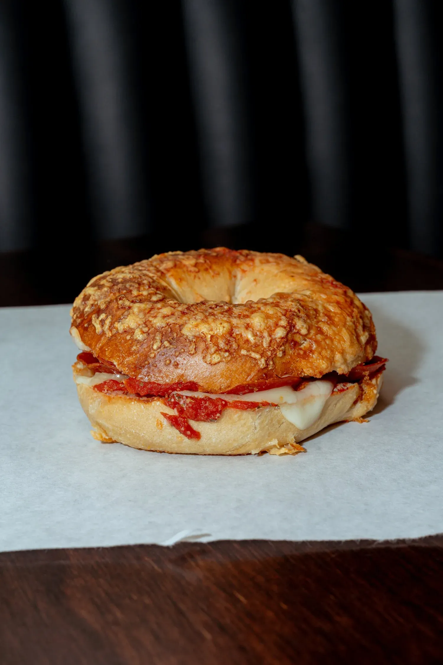 Pizza bagel with melted cheese and toppings