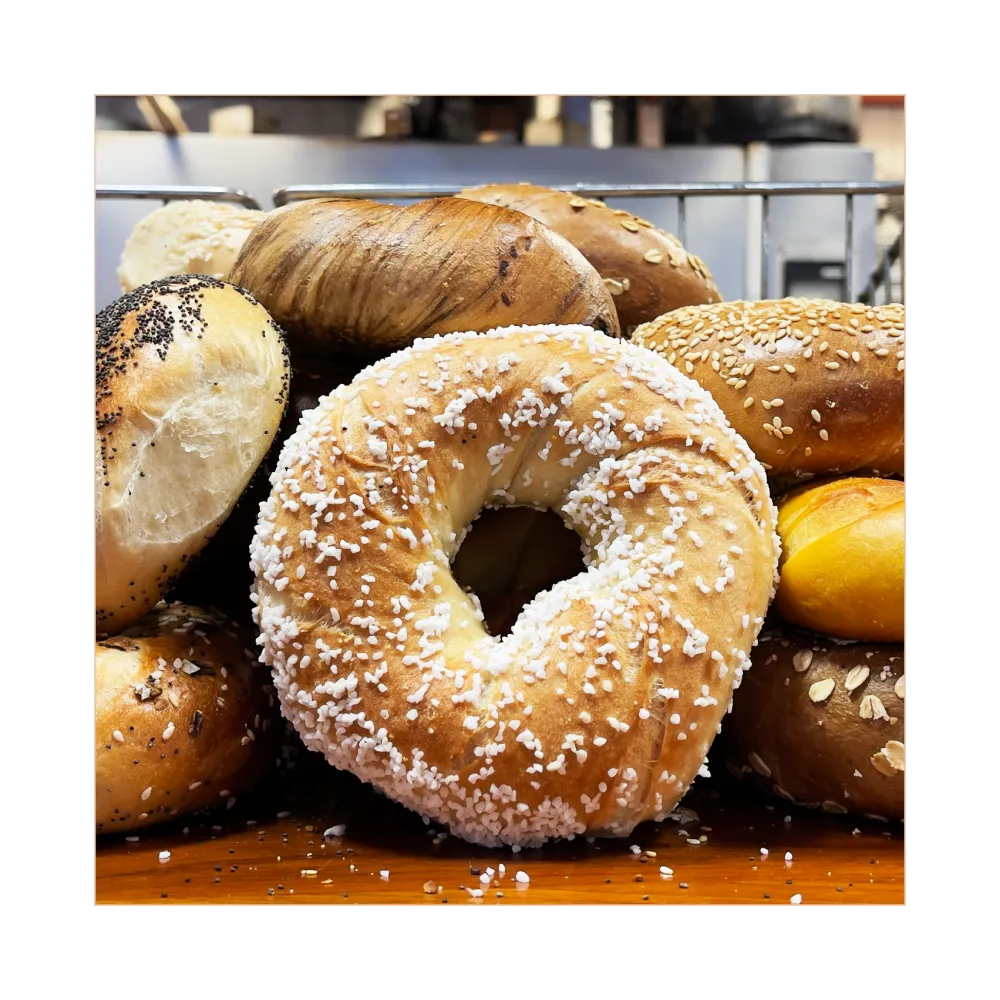 Fresh bagels on a wooden surface