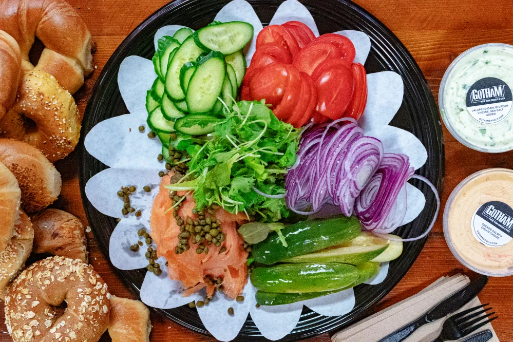 Gotham Bagels catering platter with lox and fresh vegetables