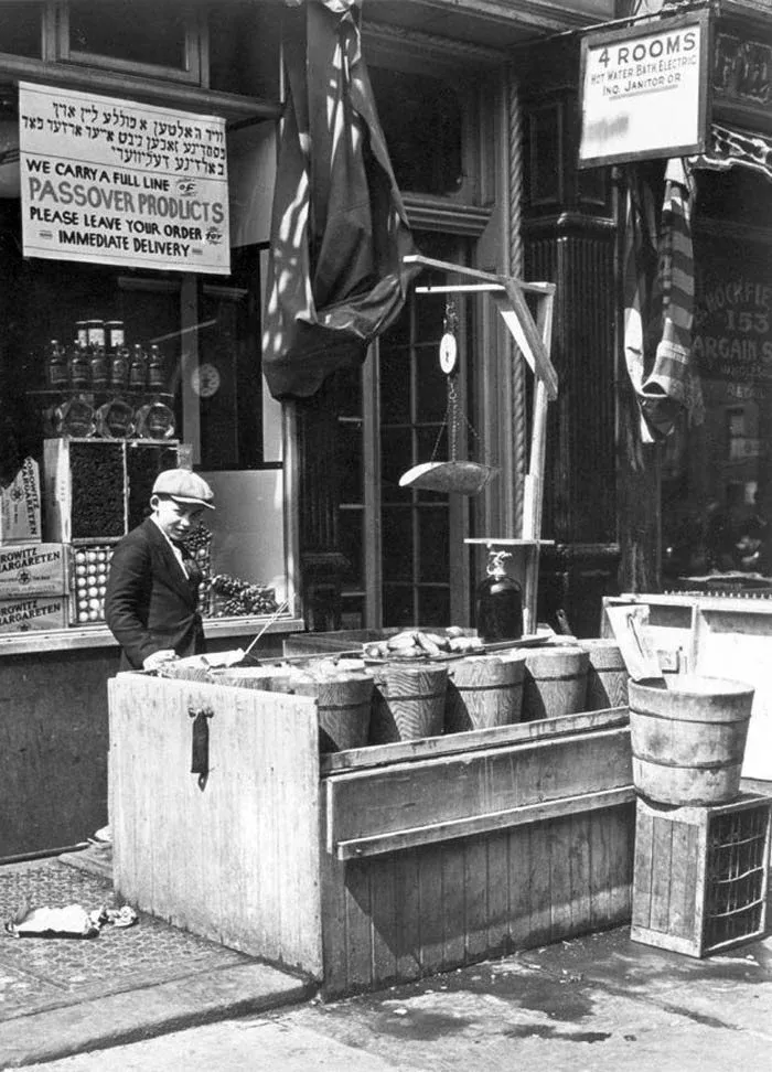 Old black and white photo of street vendors selling pickles