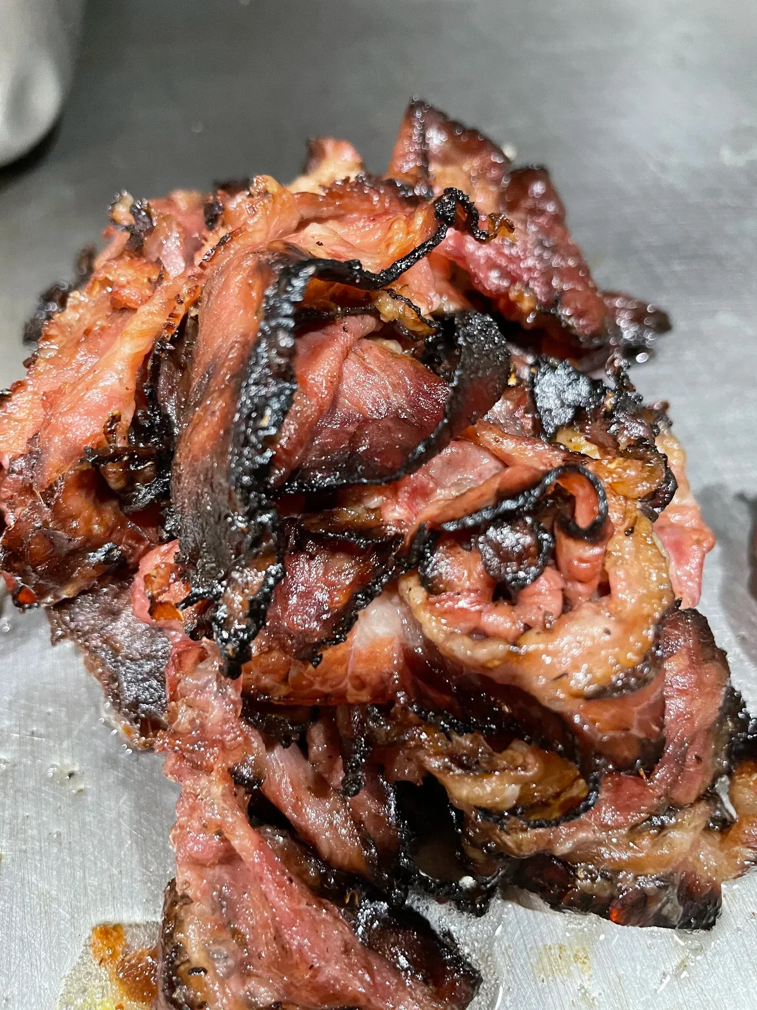 Hot pastrami on the grill at Gotham Bagels