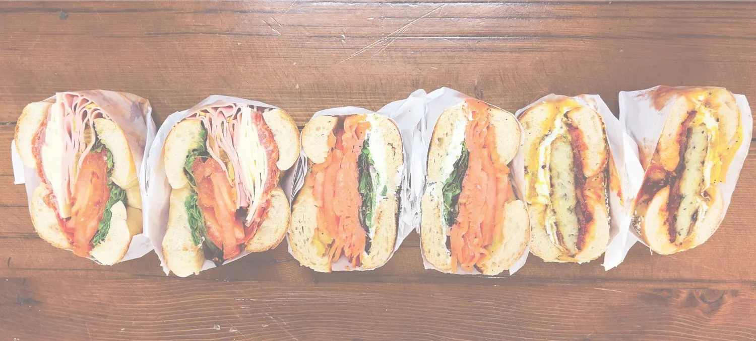 Assortment of bagel sandwiches with fresh toppings at Gotham Bagels
