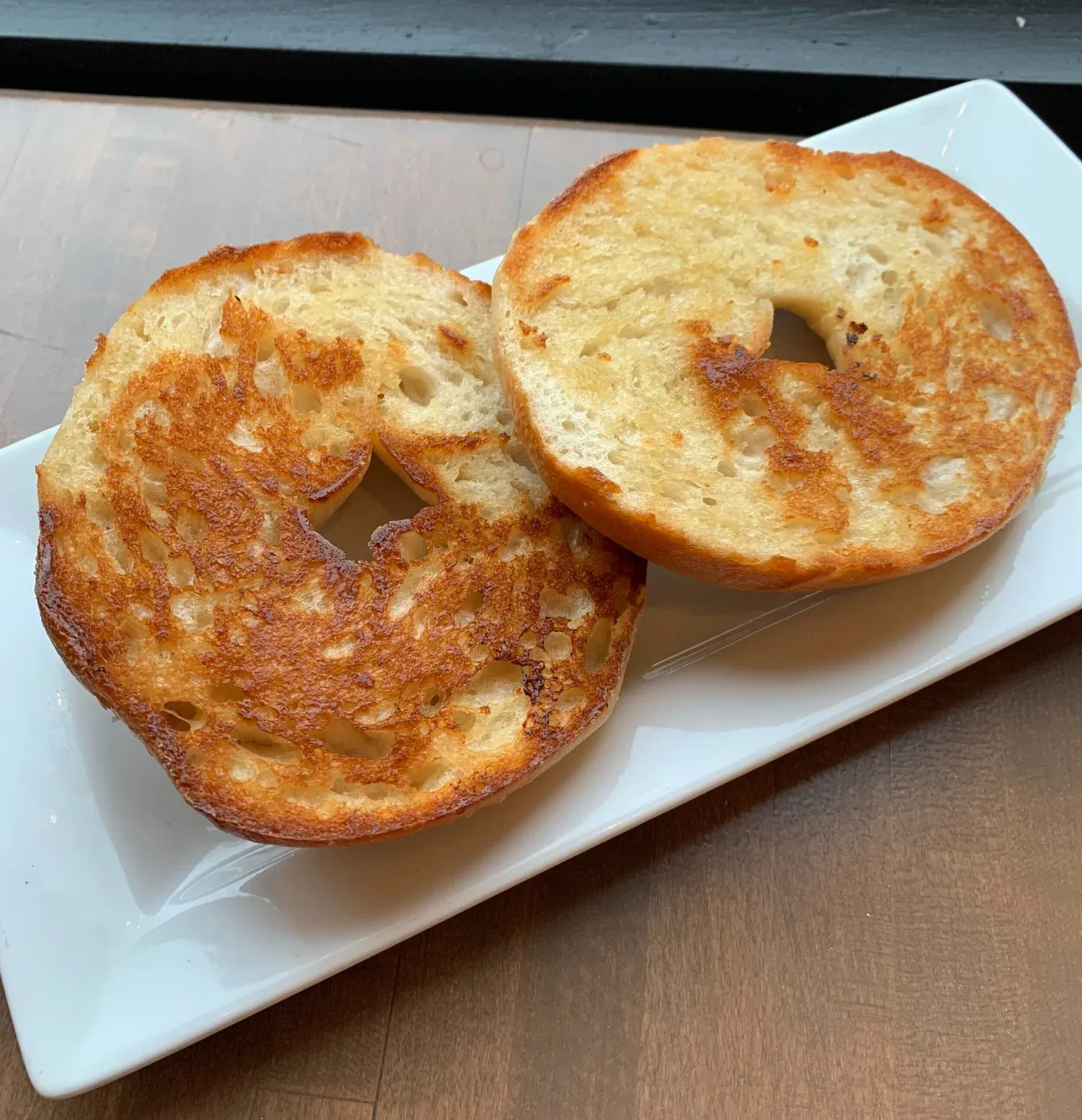Toasted bagel showing caramelized crumb
