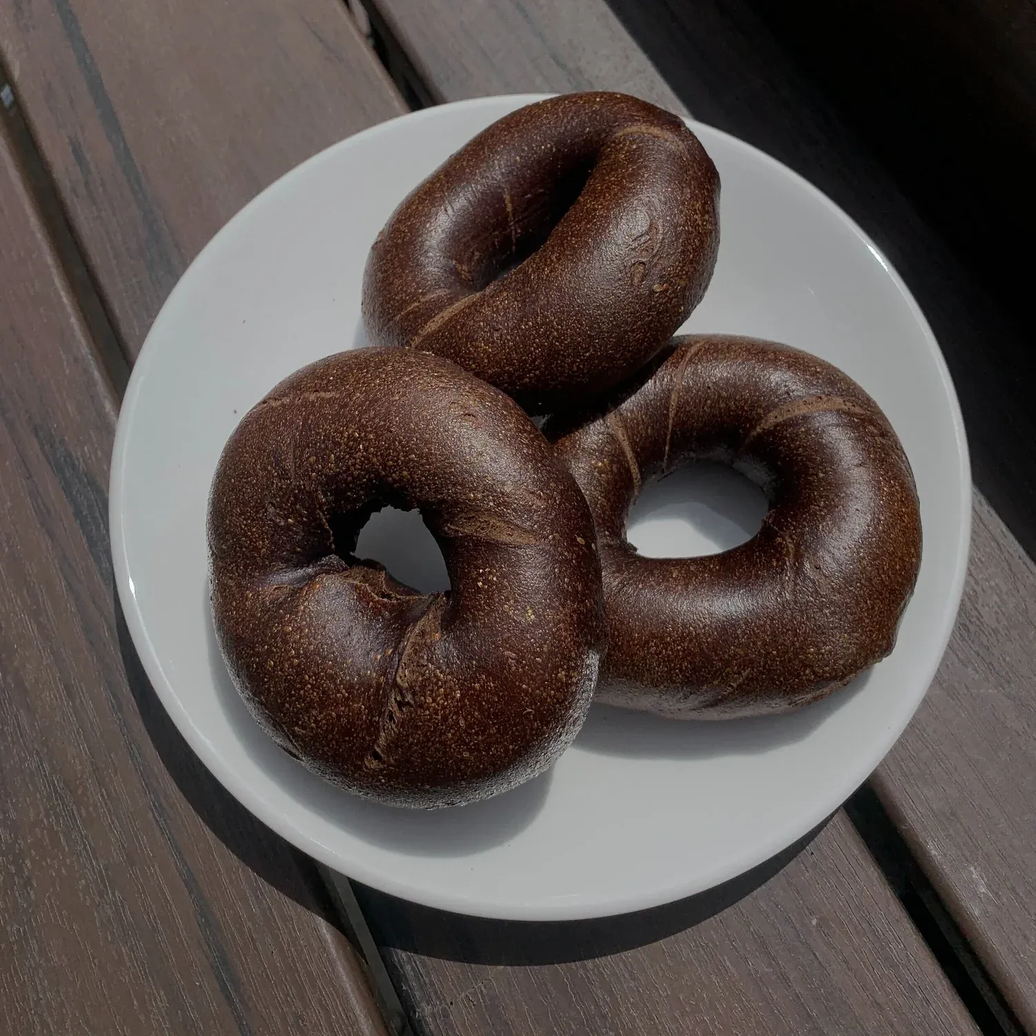 Three pumpernickel rye bagels