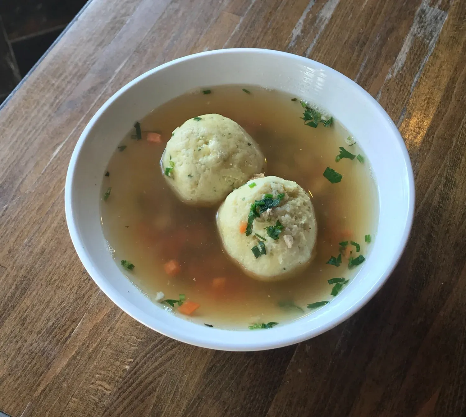 Bowl of matzo ball soup at Gotham Bagels