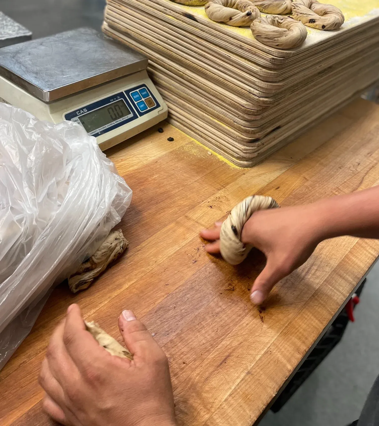 Hand-rolling bagels at Gotham Bagels