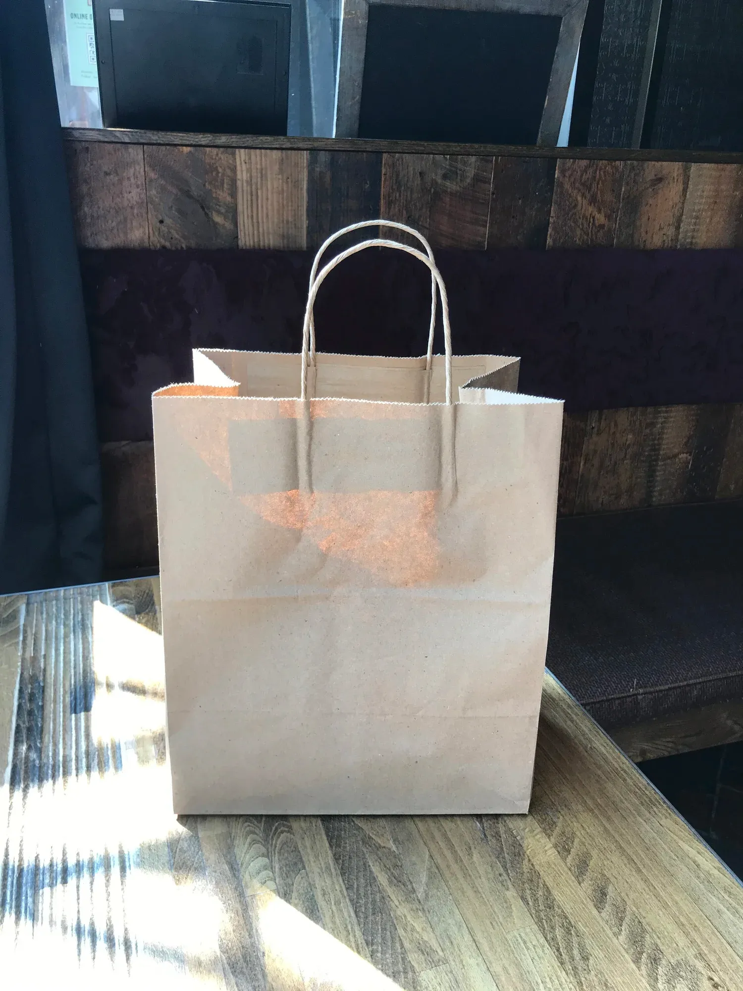 Bagels in a paper bag ready for pickup